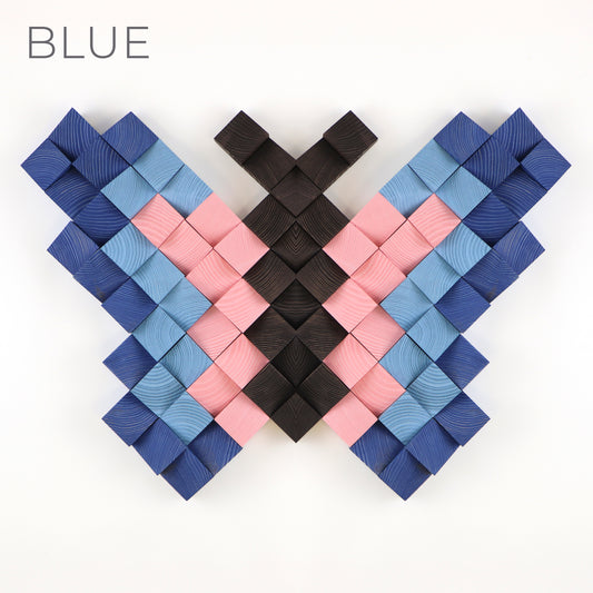 Blue and pink 3D wooden butterfly wall decor made from individually carved wooden blocks.