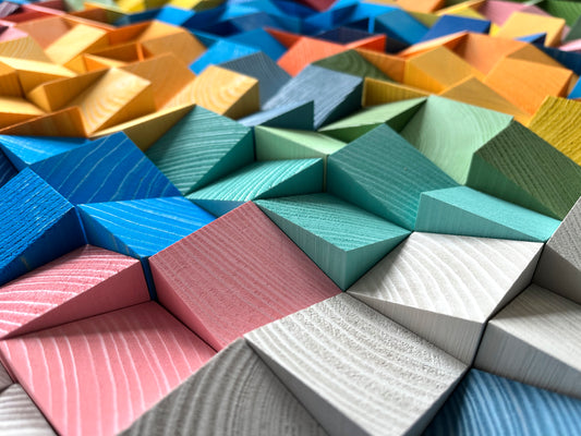 Rainbow-colored 3D wooden acoustic panel designed for modern interiors by WoodenPix.