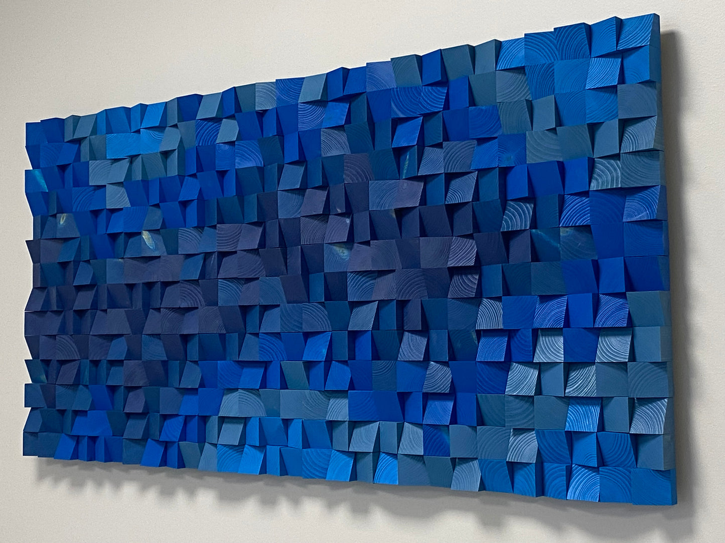 Modern blue wooden acoustic sound diffuser panel designed for stylish home and office interiors.