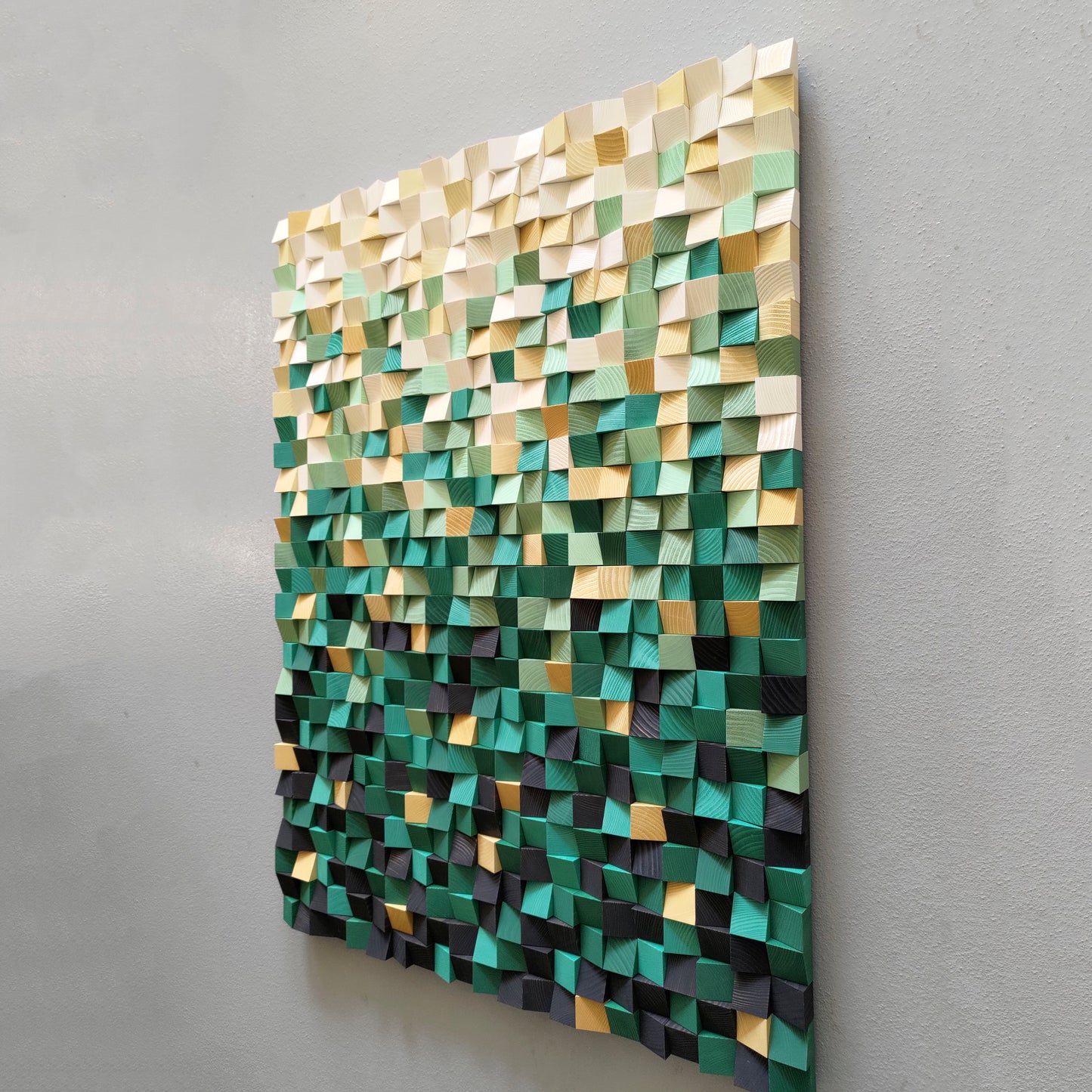 Decorative 3D wood artwork with vibrant green blocks and natural wooden highlights.