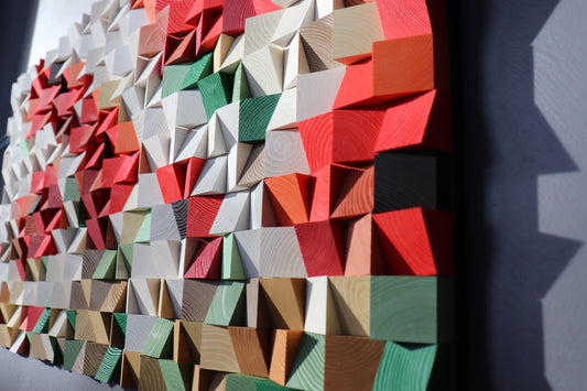 Close-up of handcrafted 3D wooden wall art by WoodenPix featuring geometric red, green, and natural wood tones.