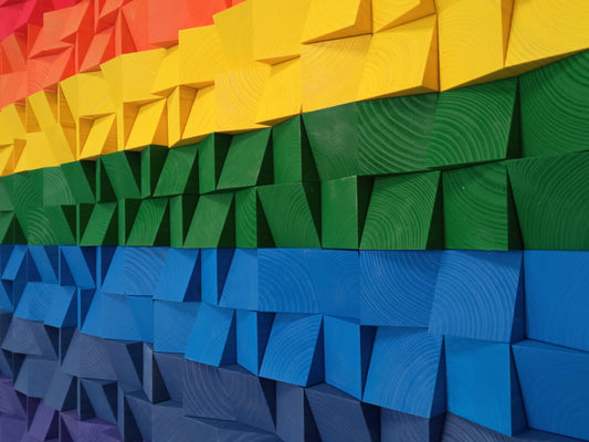 Handcrafted colorful wooden wall art that doubles as an acoustic sound diffuser and decorative panel.