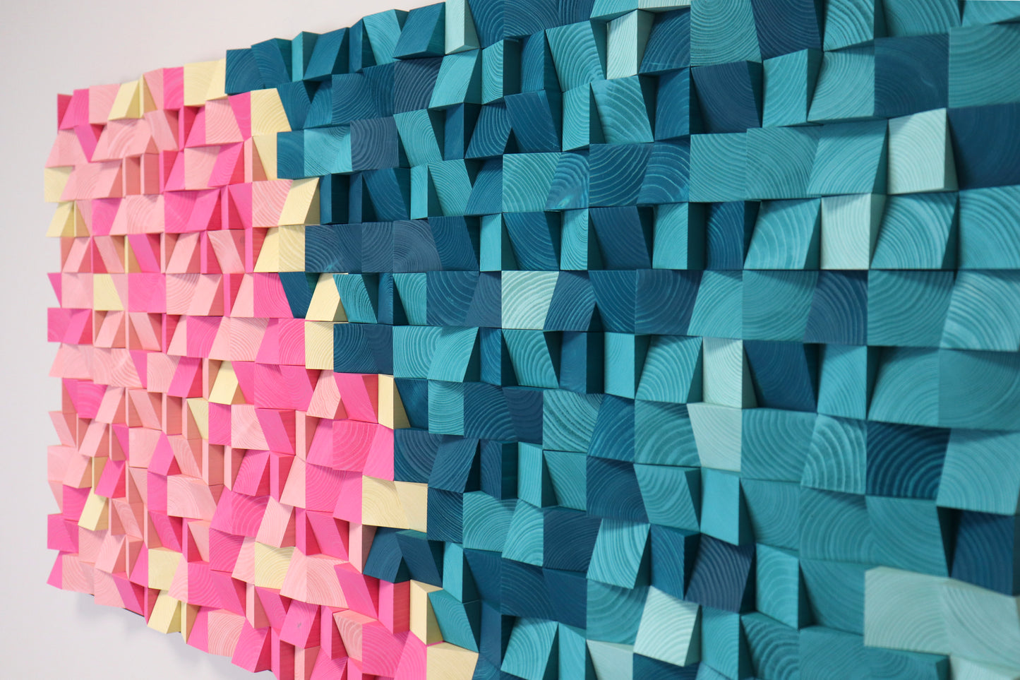 Handmade acoustic wood wall art in blue, pink, and cream tones for contemporary interior spaces.