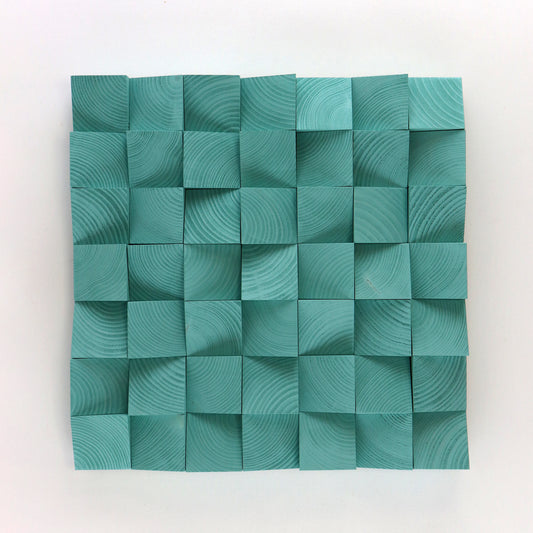 Handmade light green wood wall art made from 3D carved wooden blocks with geometric texture