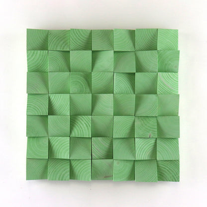 Handmade pastel green 3D wood wall art made from carved wooden blocks with geometric texture