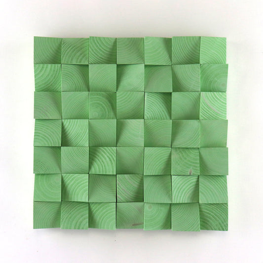 Handmade pastel green 3D wood wall art made from carved wooden blocks with geometric texture