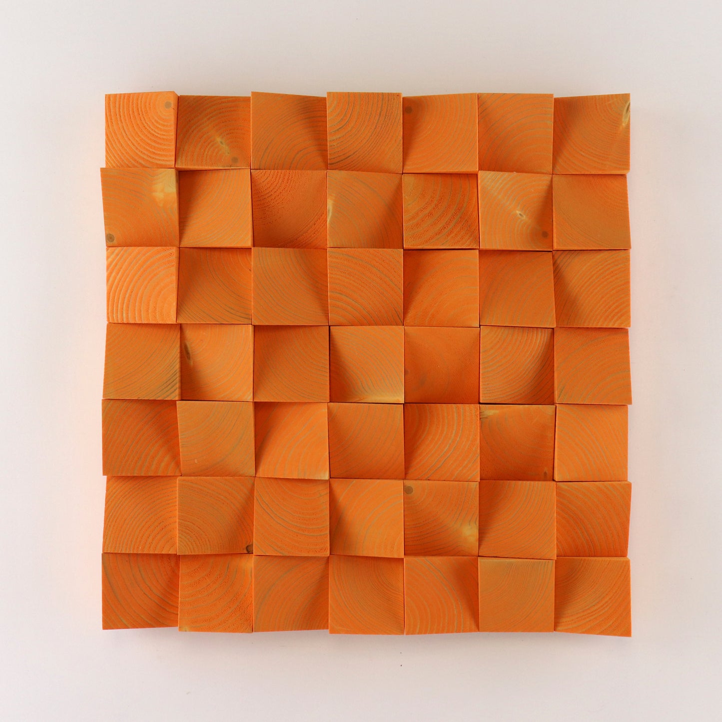 Handcrafted pastel orange 3D wooden wall art panel featuring raised geometric wood blocks with natural grain texture.