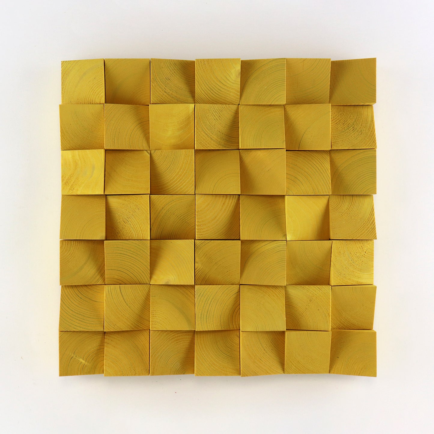 Handcrafted signal yellow 3D wooden wall art panel with raised geometric wood blocks and natural grain texture.