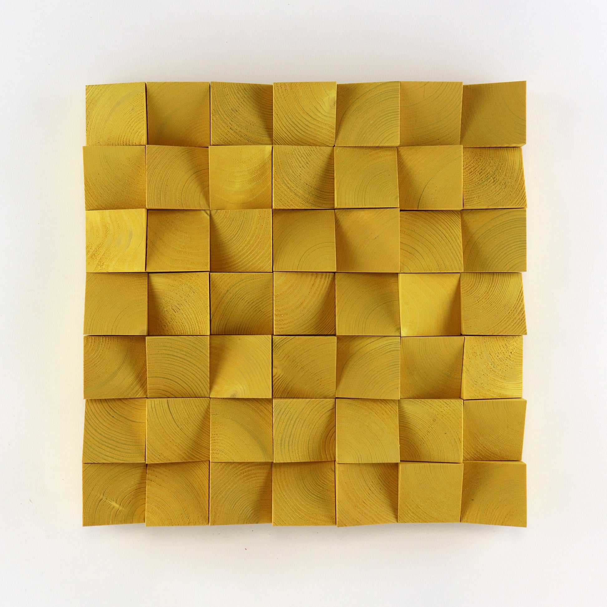 Handcrafted signal yellow 3D wooden wall art panel with raised geometric wood blocks and natural grain texture.