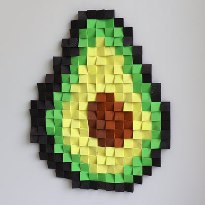 Avocado wooden wall art showing deep shadows and sculpted block shapes for a dimensional look.