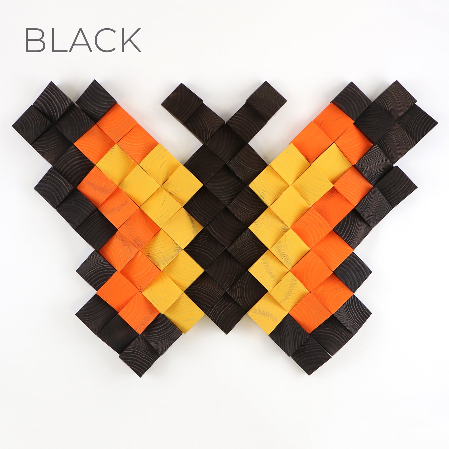 Black and orange 3D butterfly wall art crafted from natural textured wooden blocks.