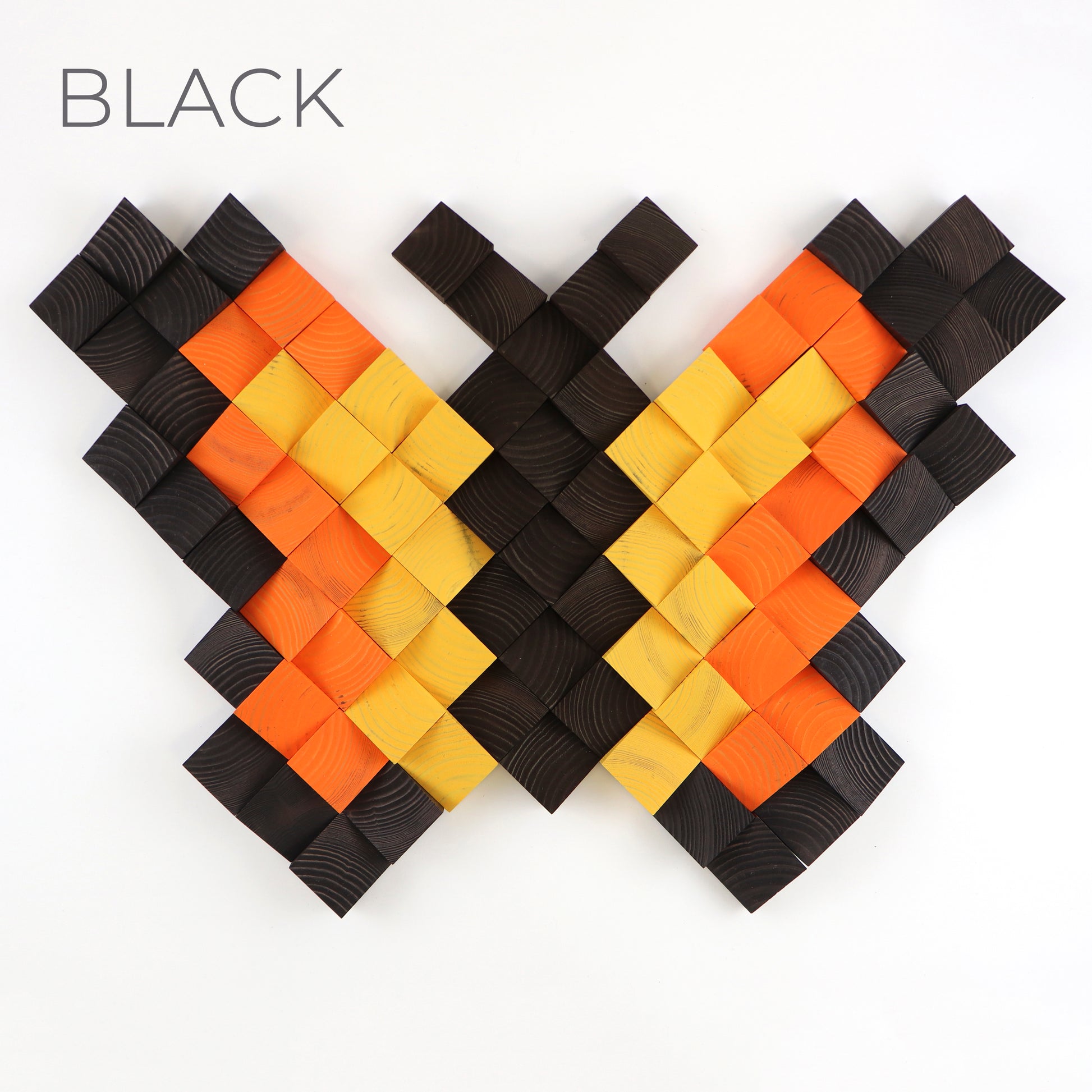 Black and orange 3D butterfly wall art crafted from natural textured wooden blocks.