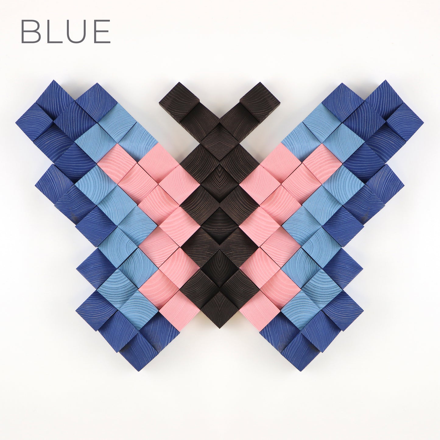Blue and pink 3D wooden butterfly wall decor made from individually carved wooden blocks.