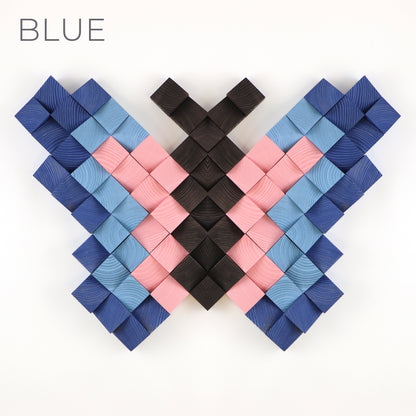 Blue and pink 3D wooden butterfly wall decor made from individually carved wooden blocks.