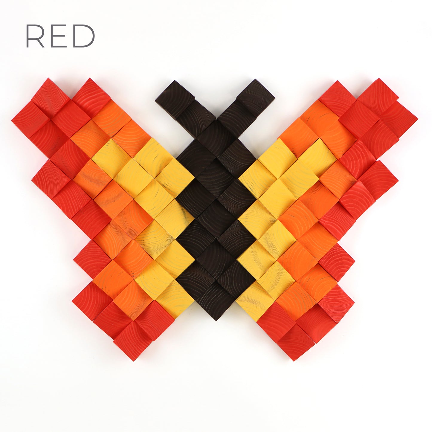 Handcrafted wooden butterfly wall art in red, orange, and yellow tones with 3D textured blocks.