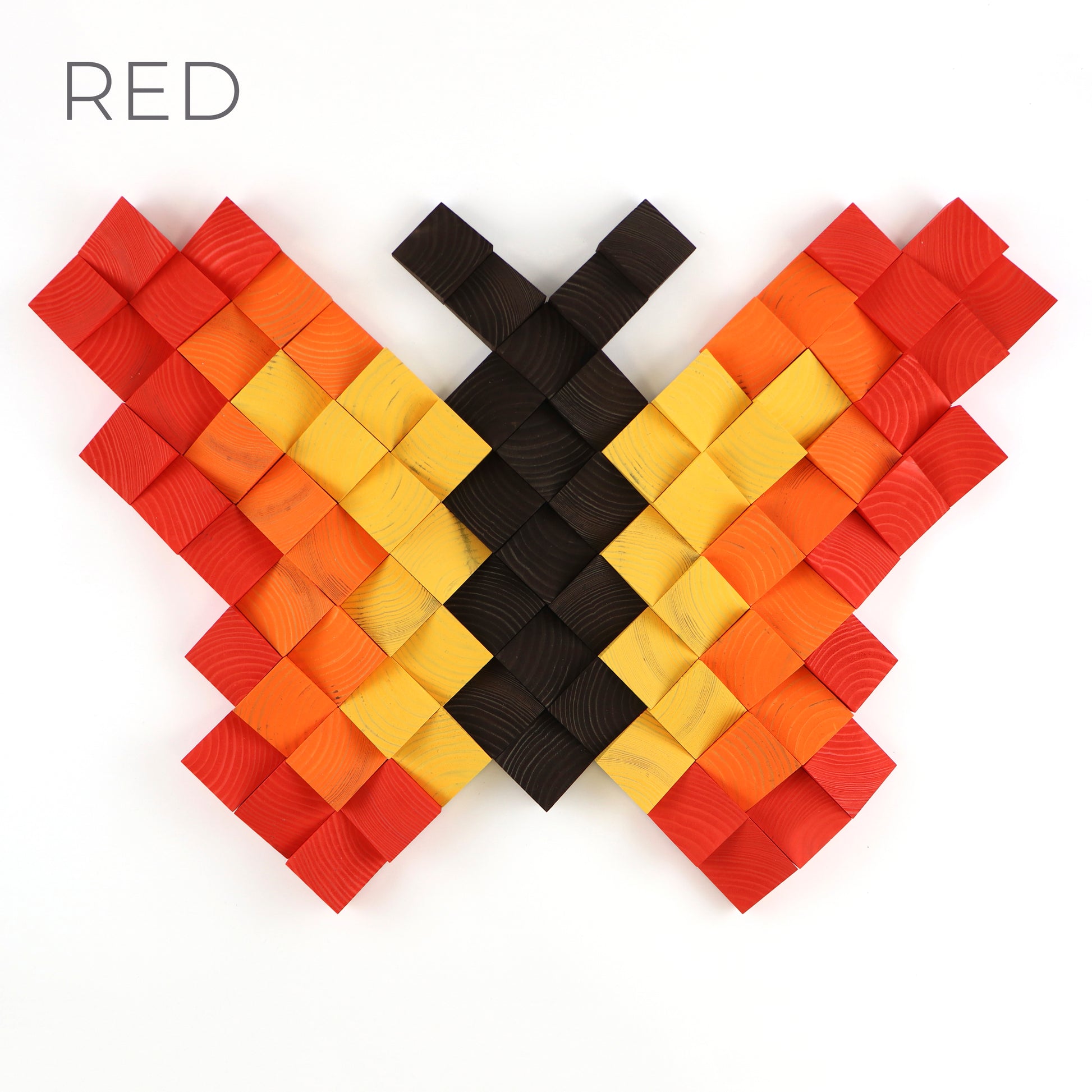 Handcrafted wooden butterfly wall art in red, orange, and yellow tones with 3D textured blocks.
