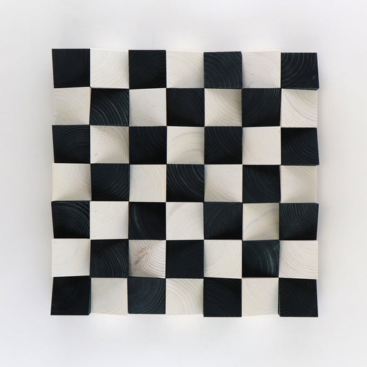 3D wooden checkerboard wall art panel featuring black and white handcrafted blocks.