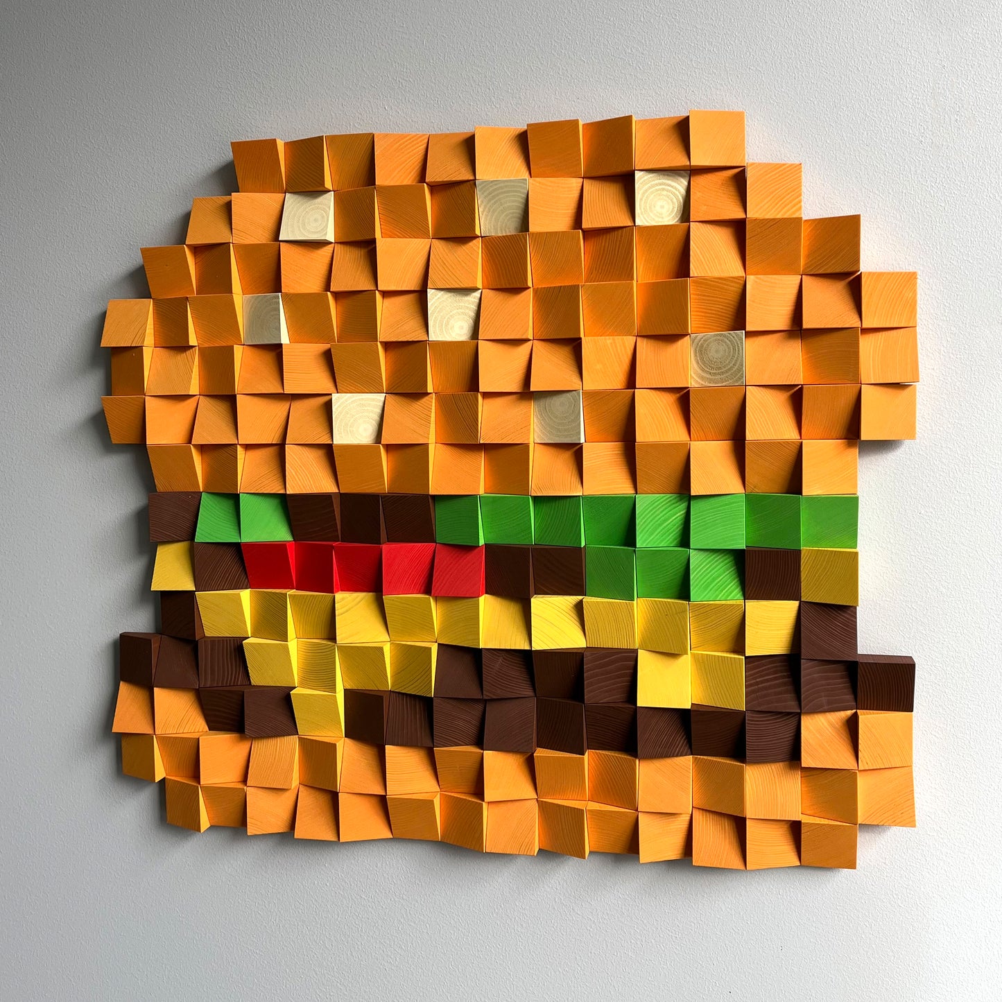 Handcrafted 3D cheeseburger wall decor featuring layered wooden cubes in warm colors