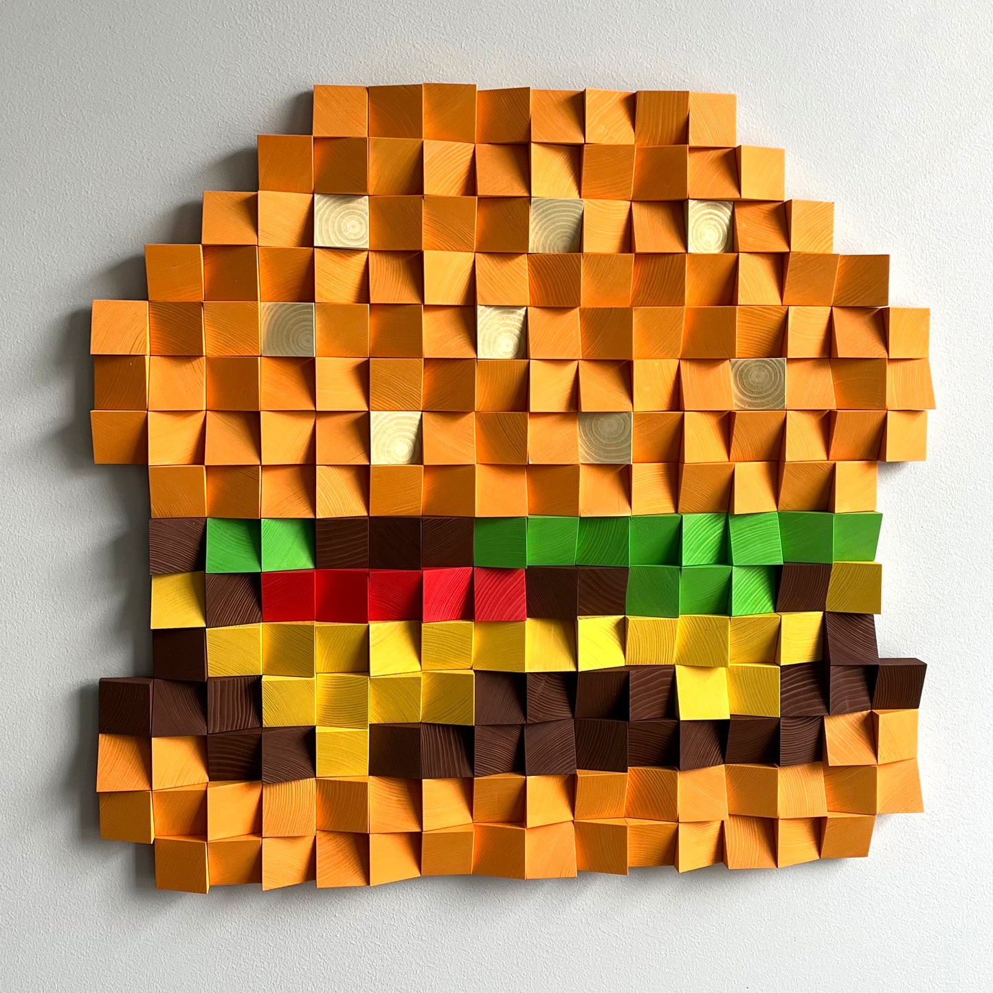 Statement cheeseburger wood art combining geometric form and playful food-inspired design