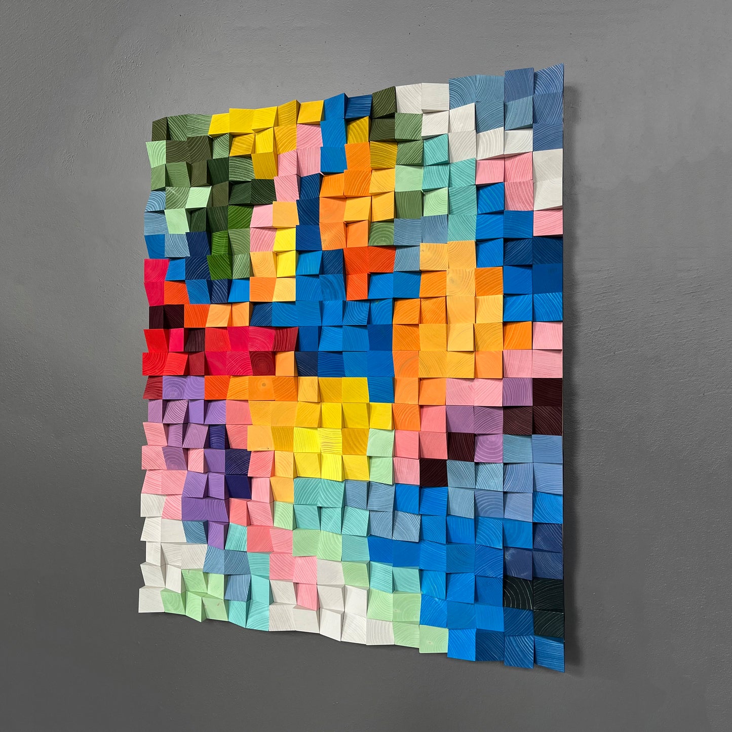 Colorful geometric wooden art panel combining sound diffusion and modern design.