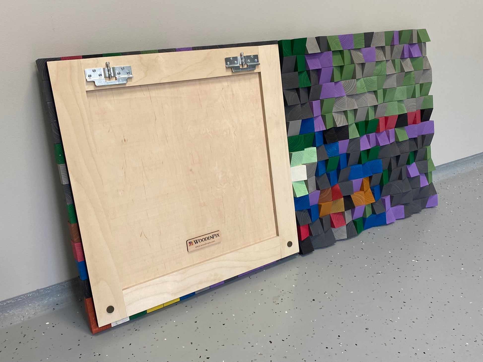 Colorful geometric wooden wall art for interior decor, offering both style and sound absorption.