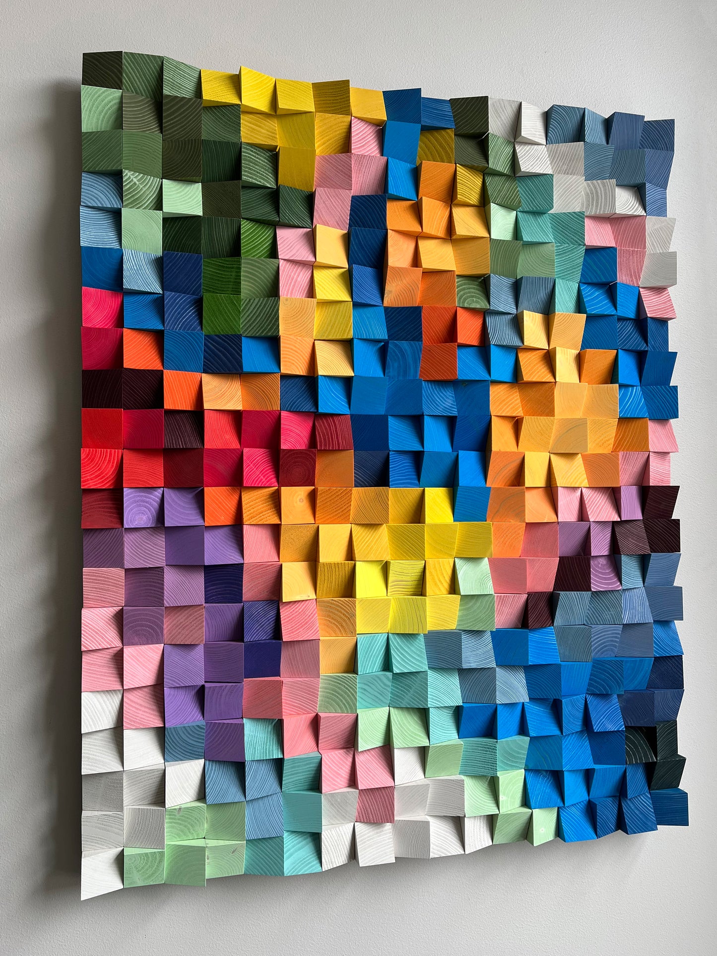 Bright handcrafted wooden wall decor featuring summer-inspired colors and unique depth.