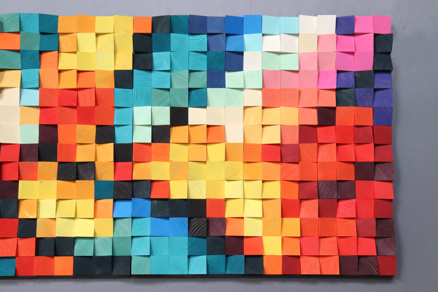 Artistic handcrafted acoustic wall art with layered wooden texture and bright palette.