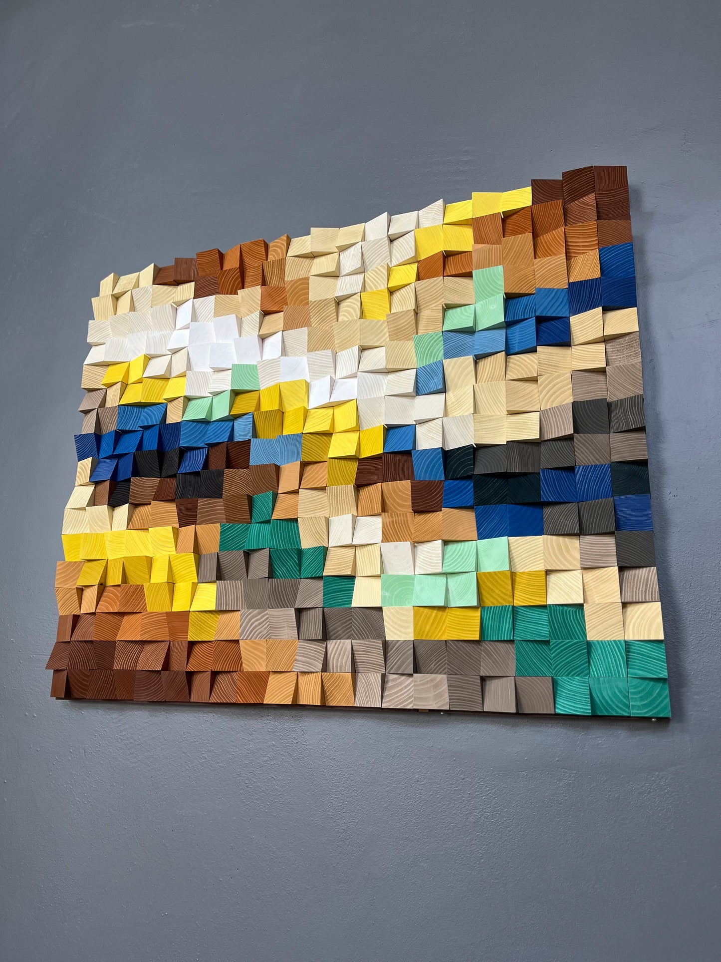 Modern handcrafted wall art with vibrant blues, greens, and warm wood tones.
