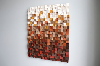Right-angle view of modern geometric wood wall sculpture in red, beige, natural tones