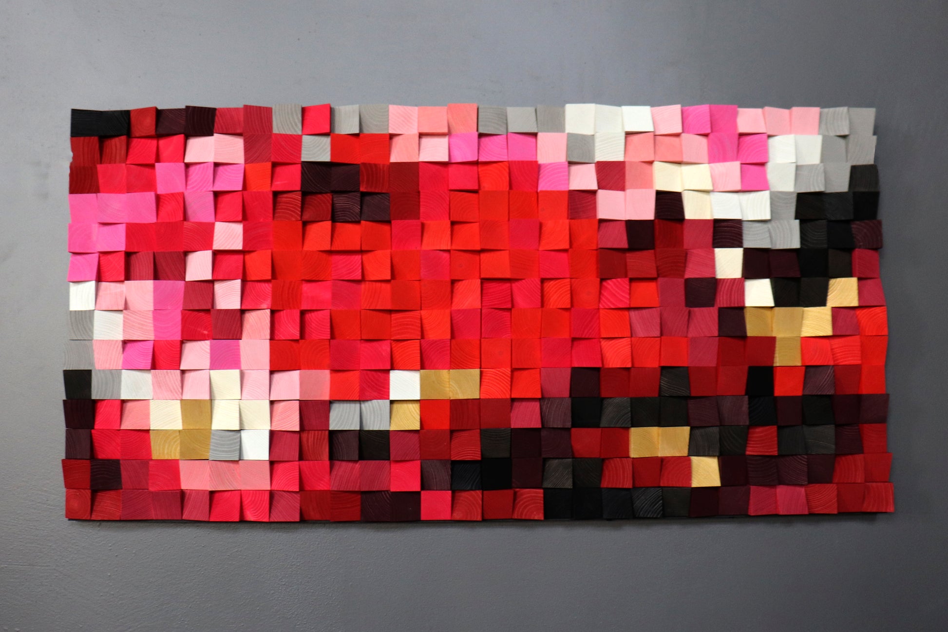 Sustainable 3D wooden wall decor symbolizing passion and energy through bold color design.