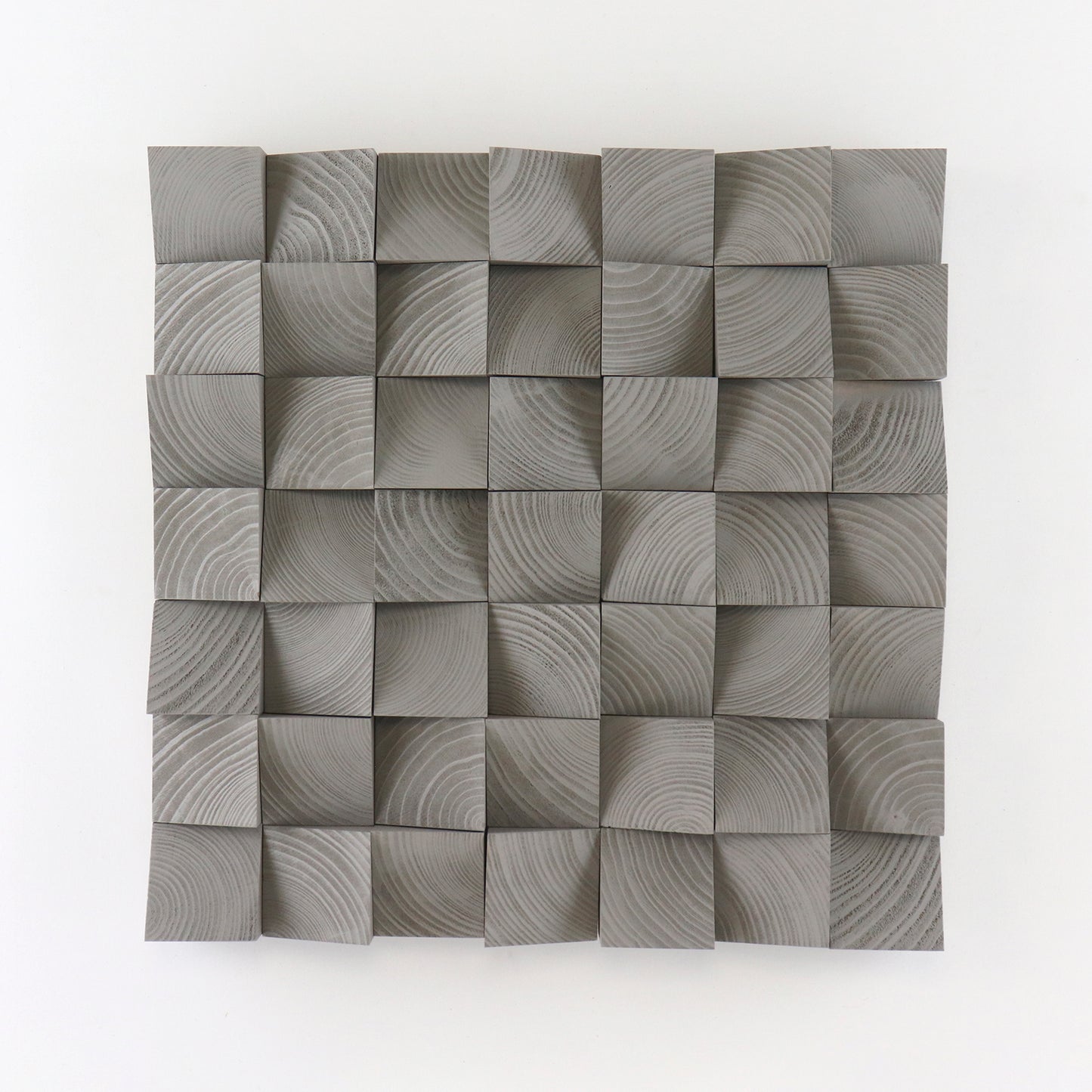 Handcrafted Grey Aluminium wooden wall panel featuring carved 3D blocks and subtle grain patterns for a modern, sculptural interior decor accent.