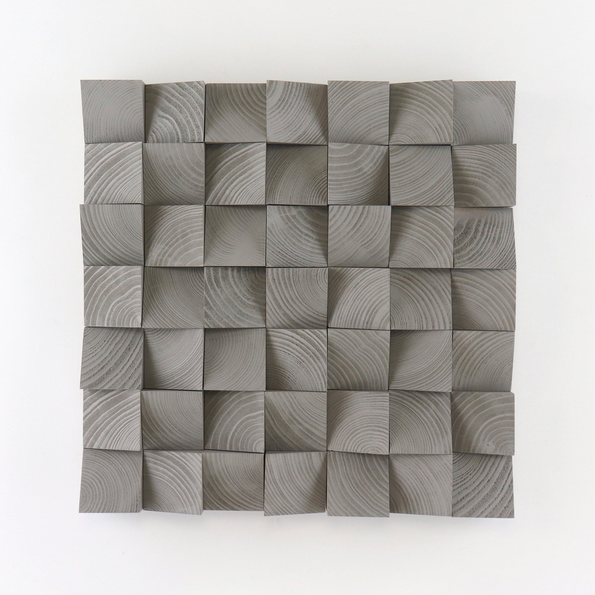 Handcrafted Grey Aluminium wooden wall panel featuring carved 3D blocks and subtle grain patterns for a modern, sculptural interior decor accent.