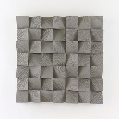 Handcrafted Grey Aluminium wooden wall panel featuring carved 3D blocks and subtle grain patterns for a modern, sculptural interior decor accent.