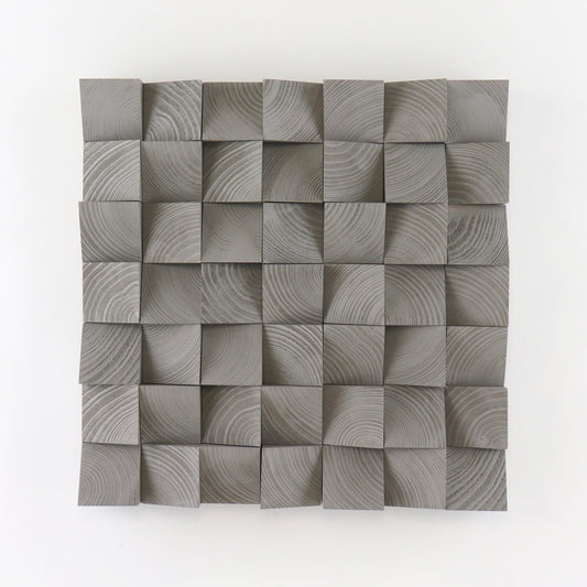Handcrafted Grey Aluminium wooden wall panel featuring carved 3D blocks and subtle grain patterns for a modern, sculptural interior decor accent.