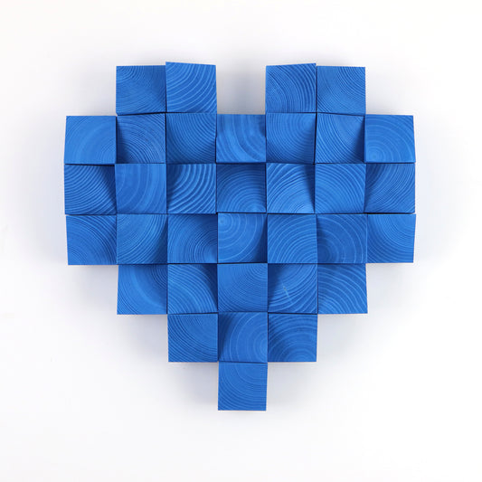 Handcrafted blue heart wall decor made from painted wooden cubes with sculptural depth