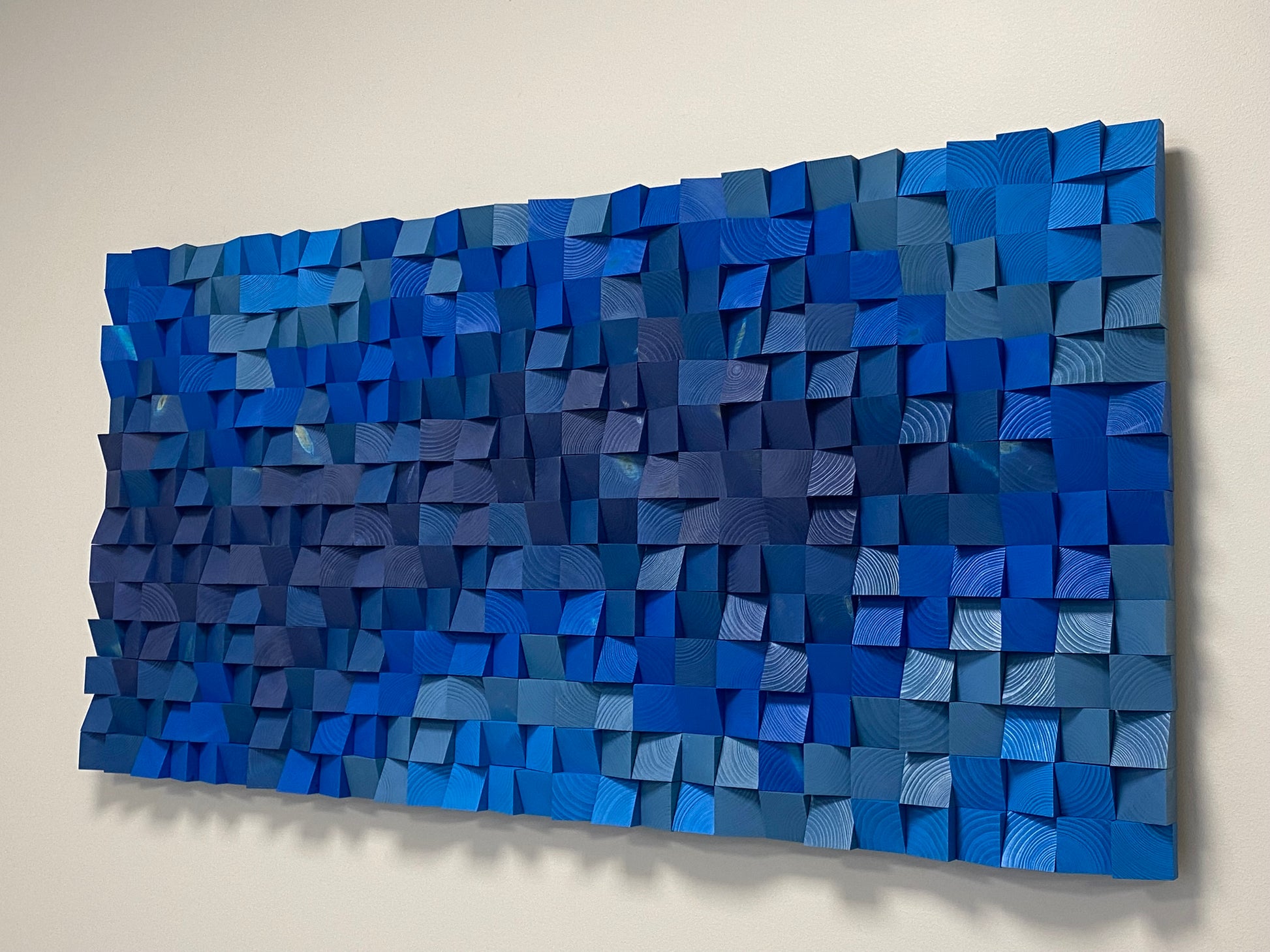 Modern blue wooden wall decor designed for sound diffusion and stylish interiors.