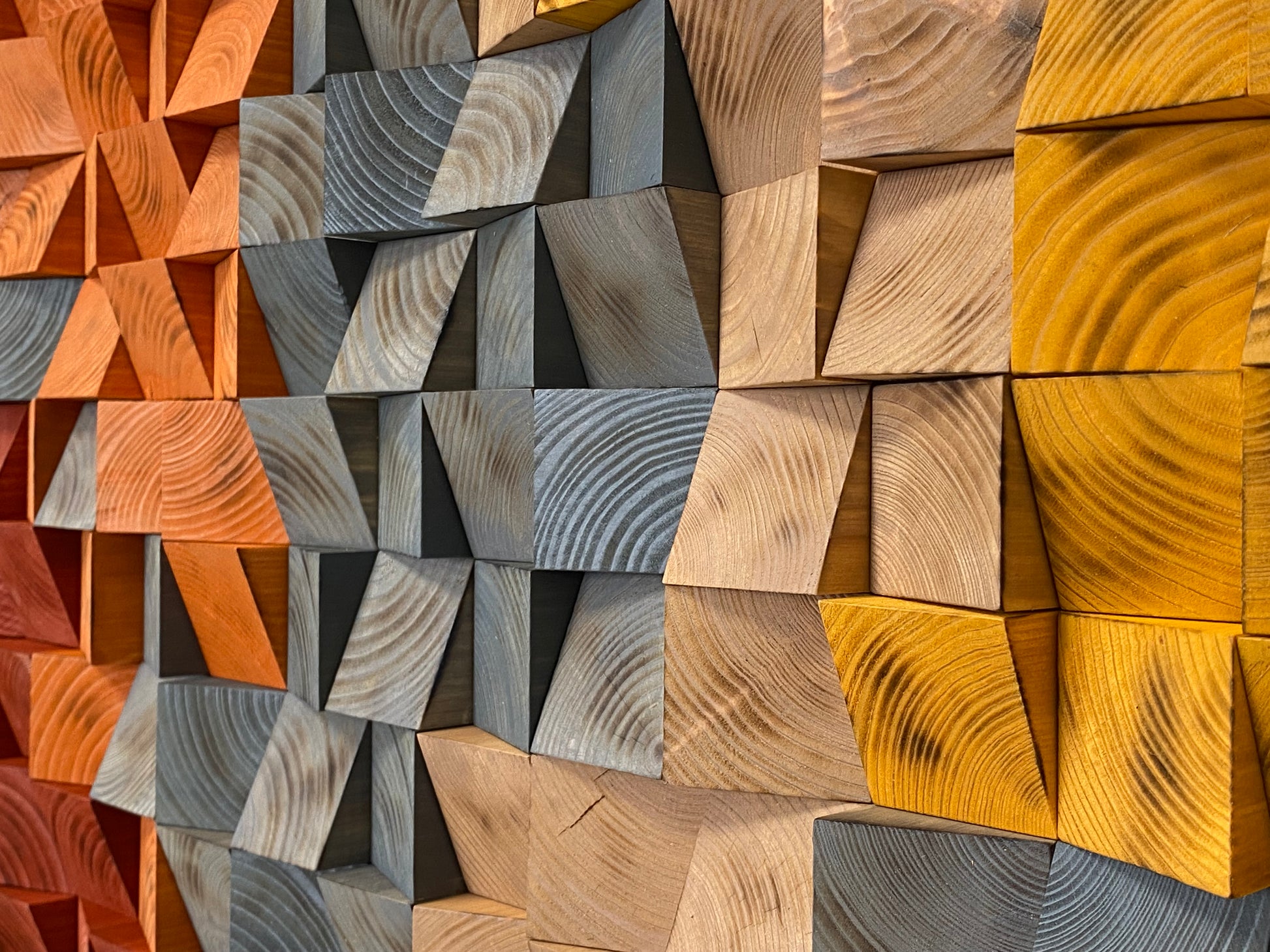 Handmade 3D wooden wall art in rustic amber, brown, and gray shades for modern interiors.