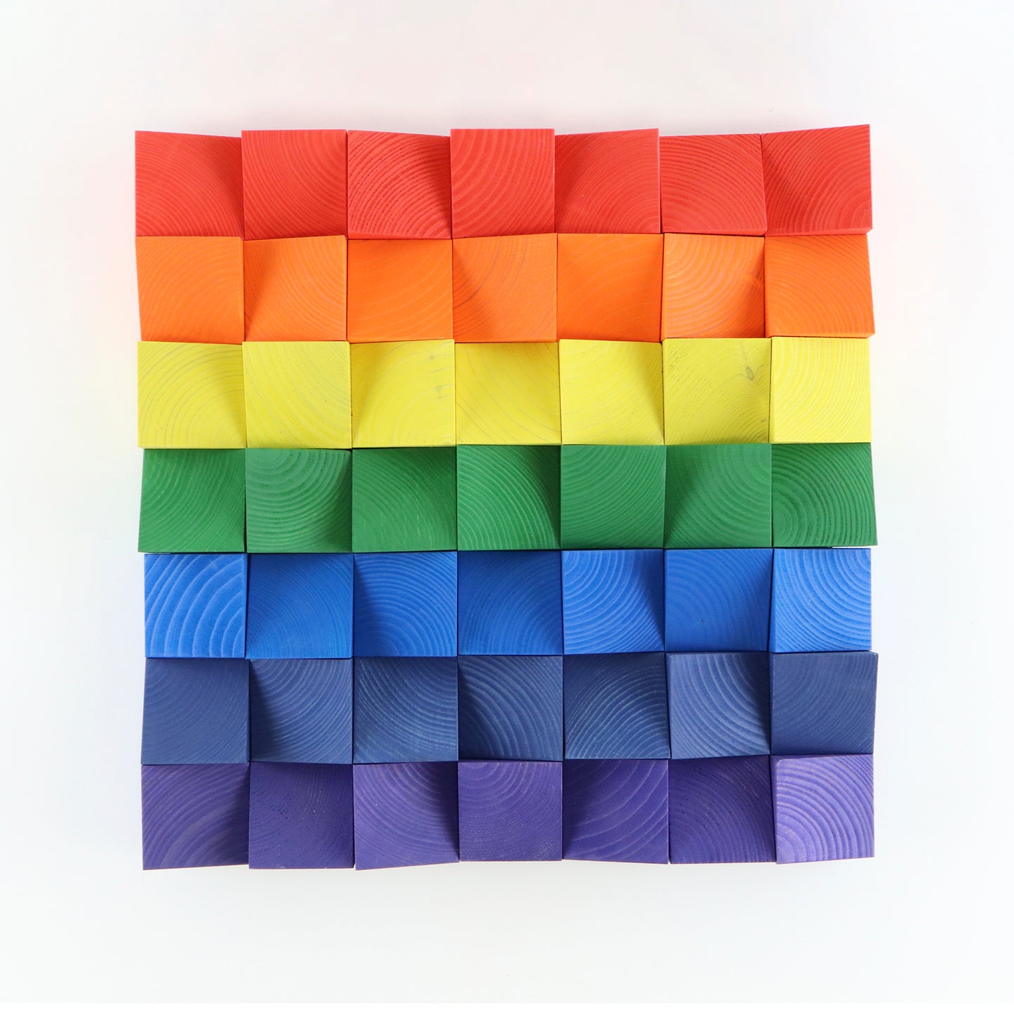 Rainbow 3D wooden wall art panel with handcrafted multicolor blocks.