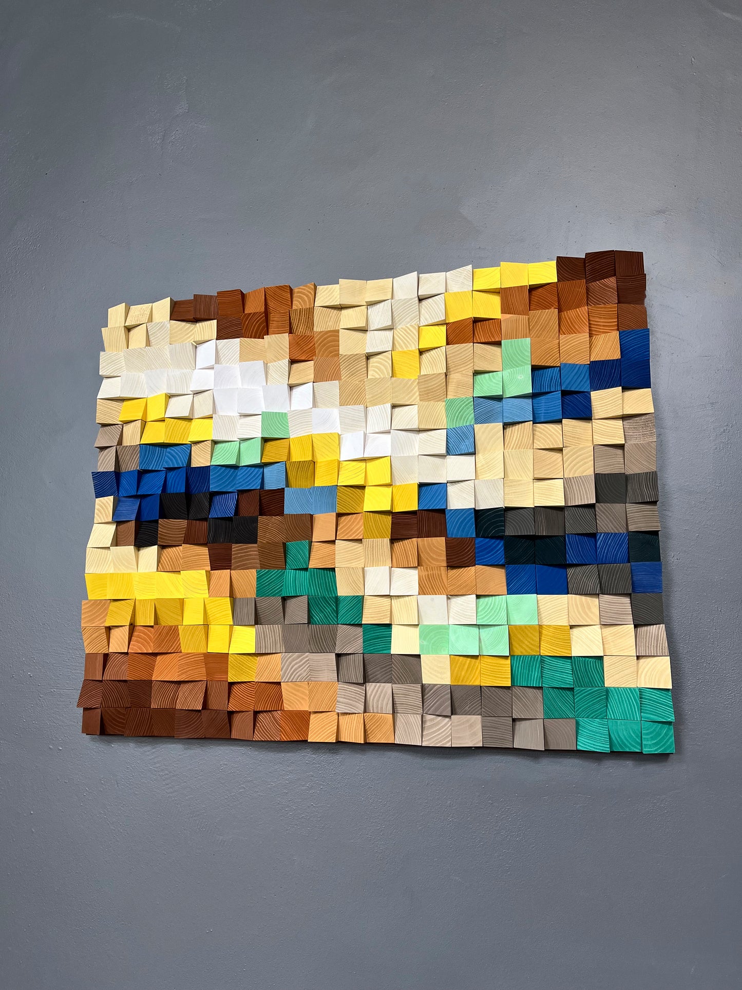 Nature-inspired 3D wooden sound diffuser blending earth, sand, and sky shades for balance.