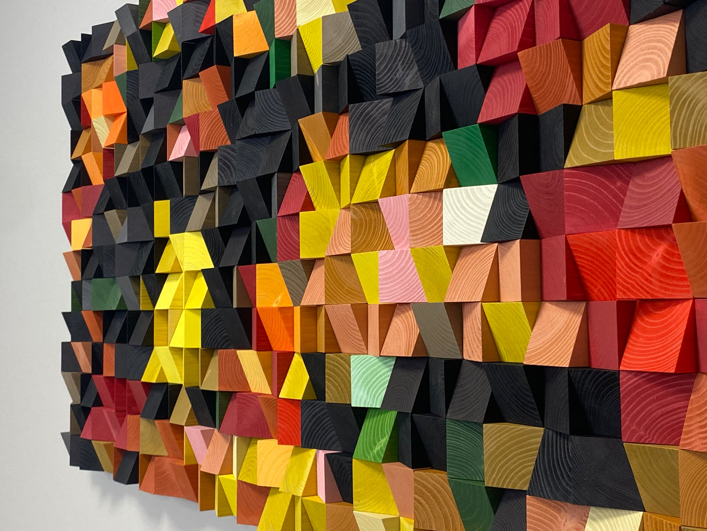 Multicolor handcrafted wooden wall art blending design, texture, and acoustic balance.