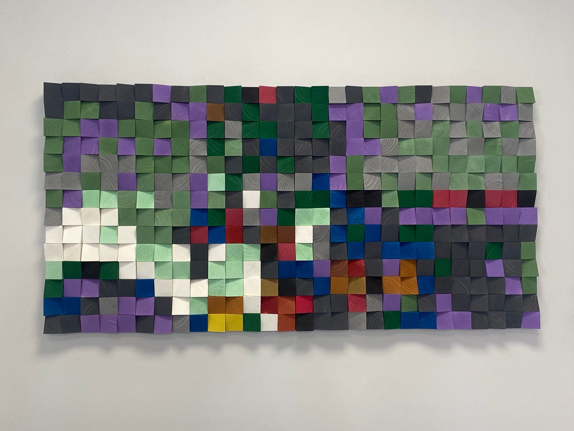 Handmade 3D wooden wall panel in multicolor design enhancing sound balance and visual interest.