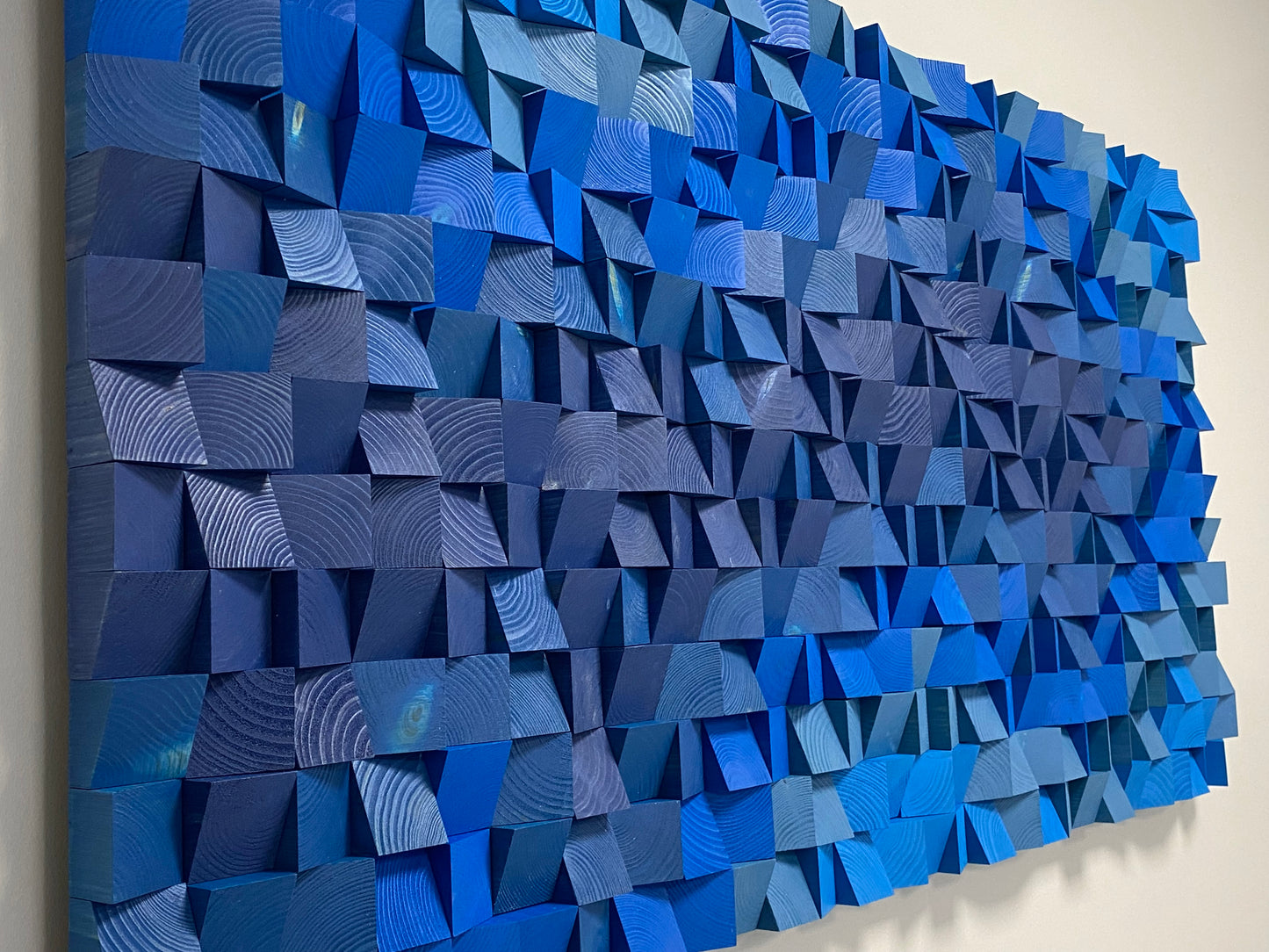 Contemporary ocean-inspired wooden acoustic wall decor in rich blue gradient.