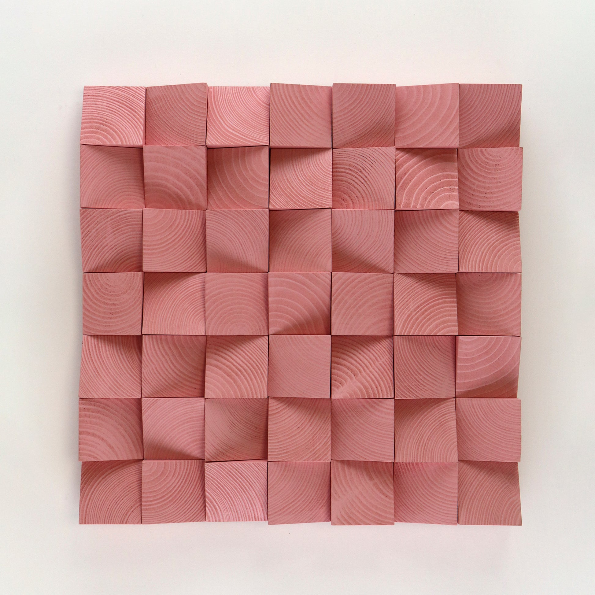 Handcrafted Light Pink 3D wooden wall panel with sculpted geometric blocks and soft pastel tones, creating a warm and elegant textured art piece.