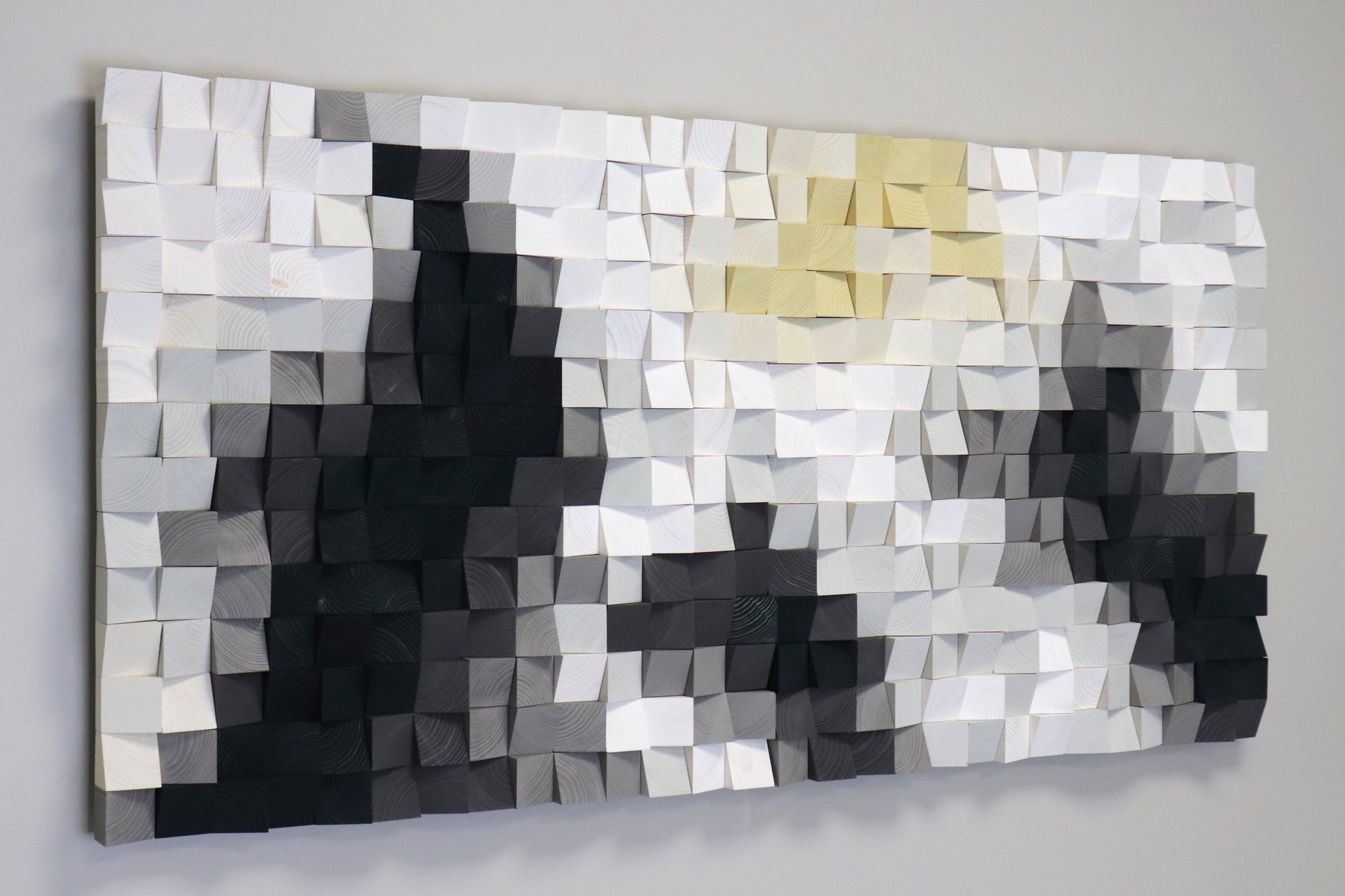 Minimalist Scandinavian-style wooden wall panel with soft white and grey hues.