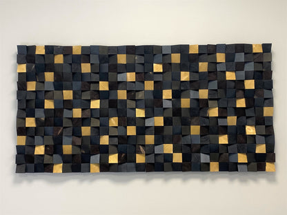 Modern black and gold 3D wall art adding texture and depth to contemporary interiors.