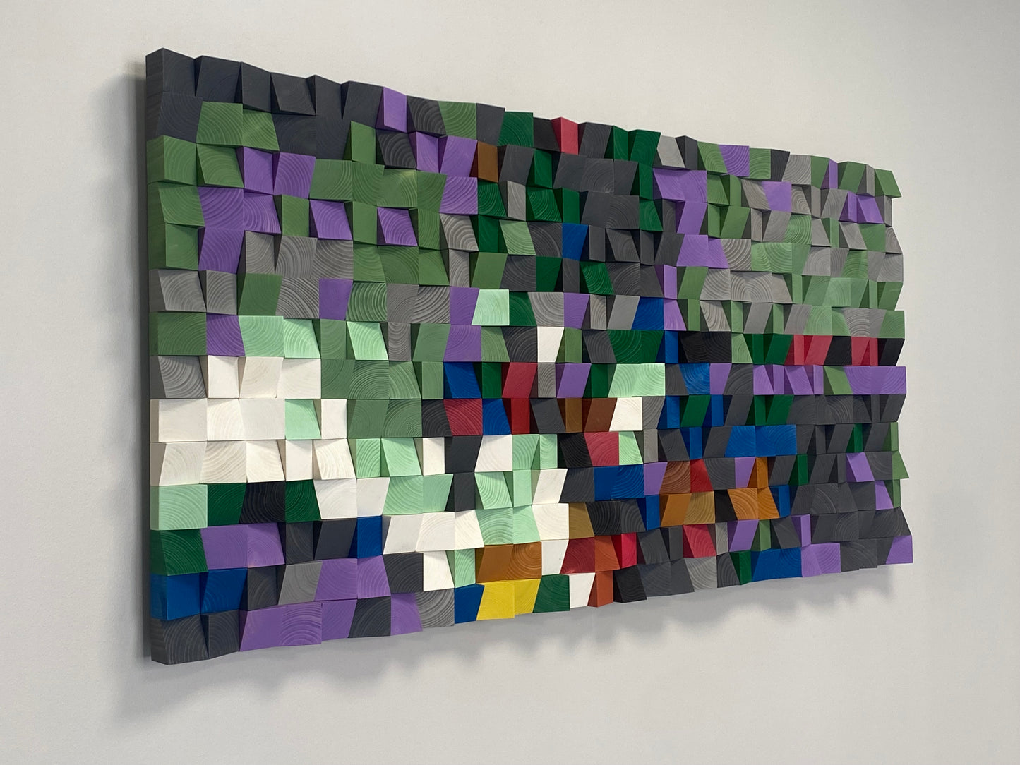 Modern acoustic wall panel by WoodenPix featuring geometric wood blocks in rich, calming hues.