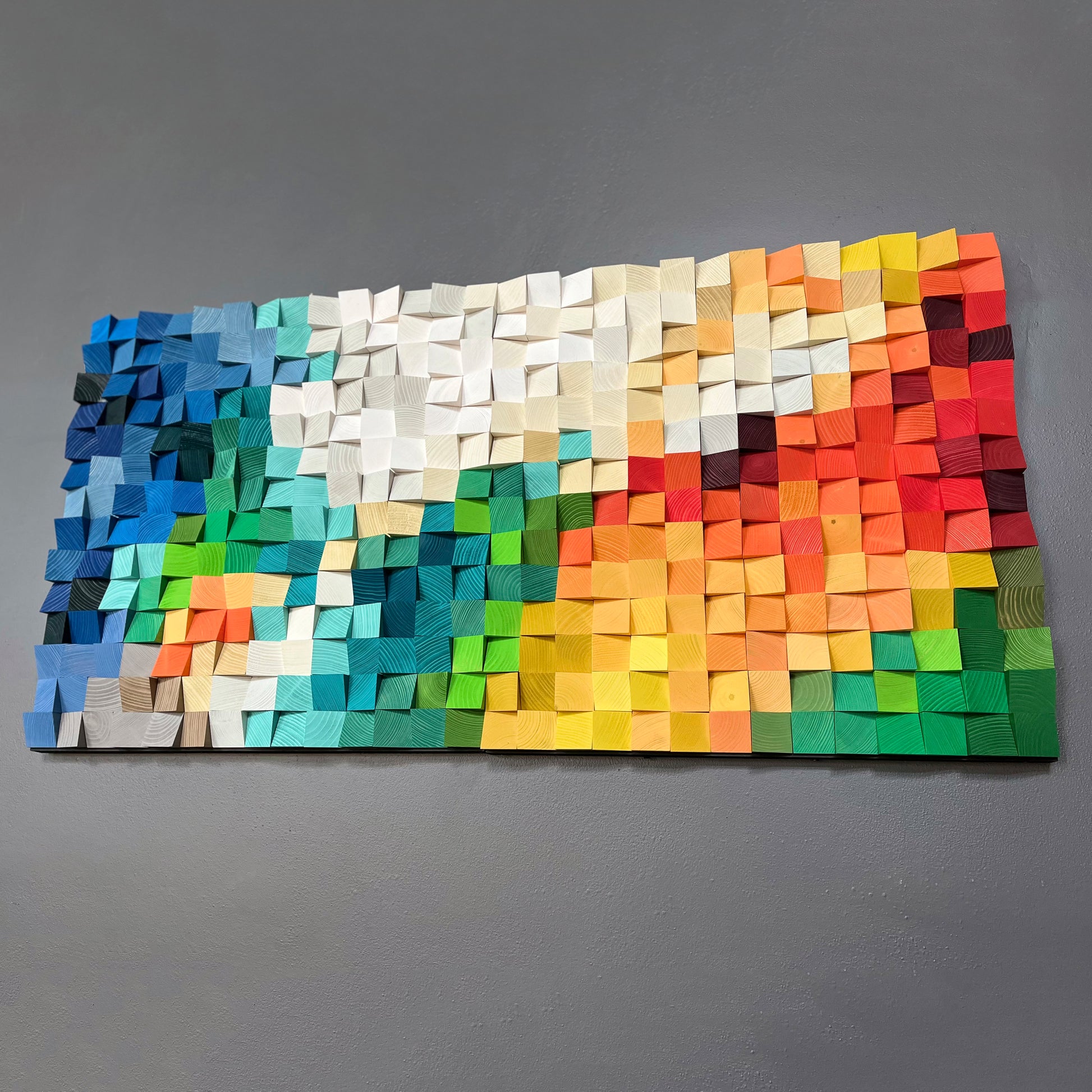 Dynamic handmade 3D wooden wall decor with bright gradient tones and natural patterns.
