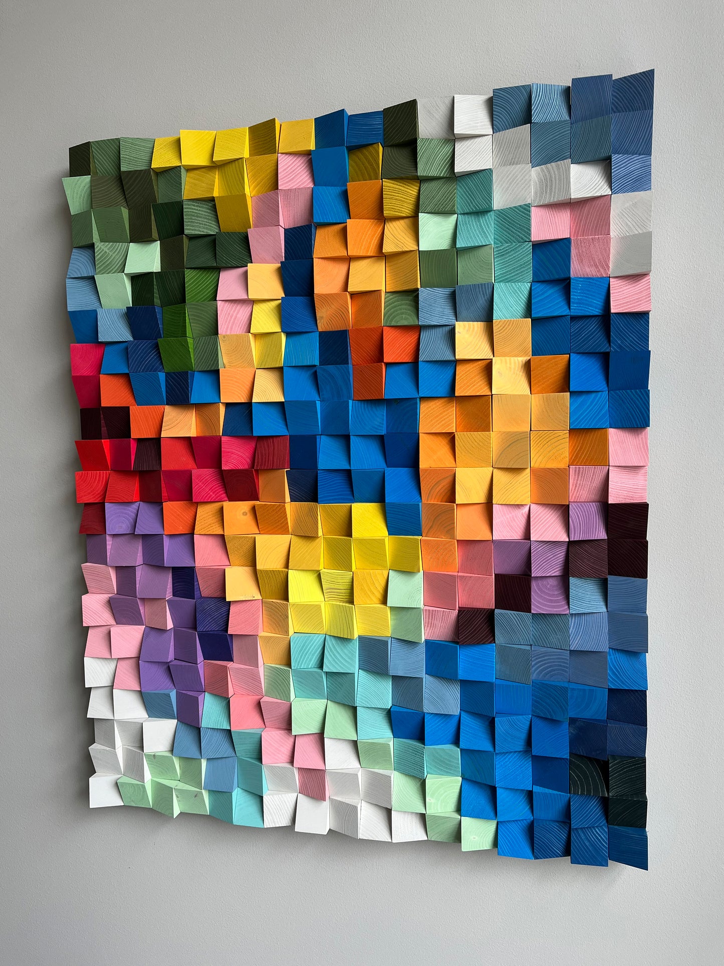 Modern pixel-style 3D wooden wall piece with bold multicolor gradient design.