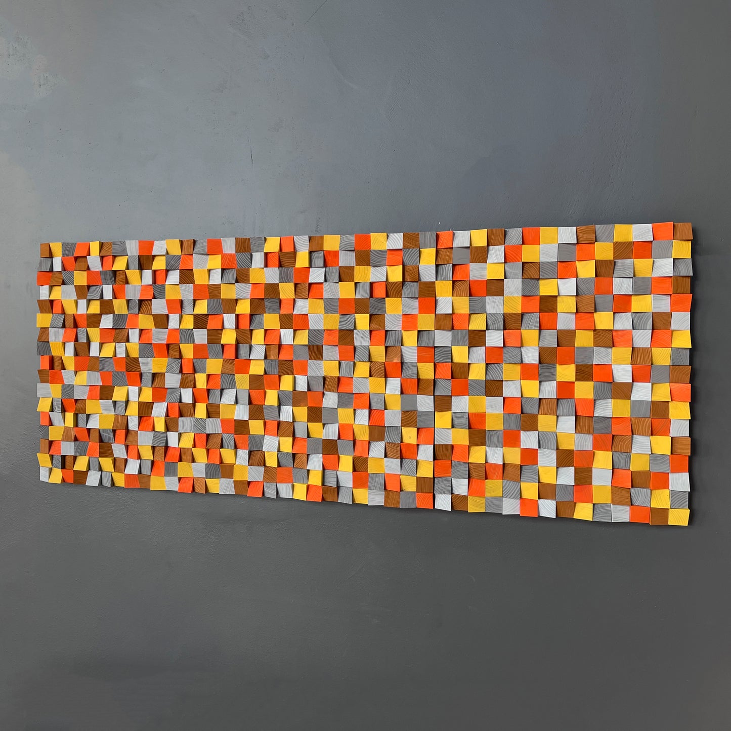 Modern wooden wall piece with bold color contrasts for visual and acoustic depth.
