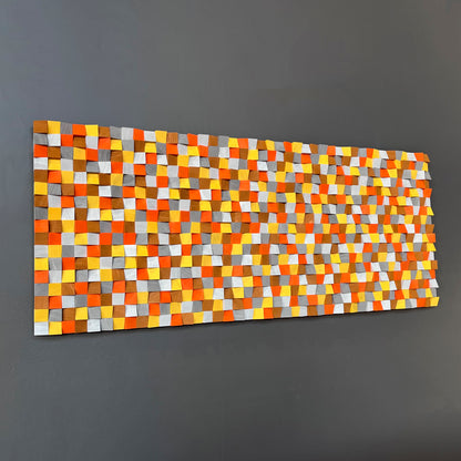 Modern handcrafted acoustic wall panel combining orange, yellow, and neutral tones for sound diffusion.